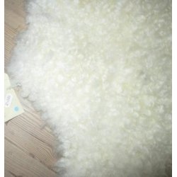 Rhvidt lokket skind med meget svage mrke strejf